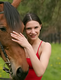 Lusty brunette gal Katya N takes off her red lingerie and then rides her horse naked.